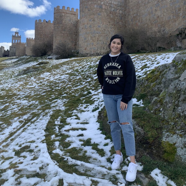 Jacqueline Garcia standing in front of a castle in Spain